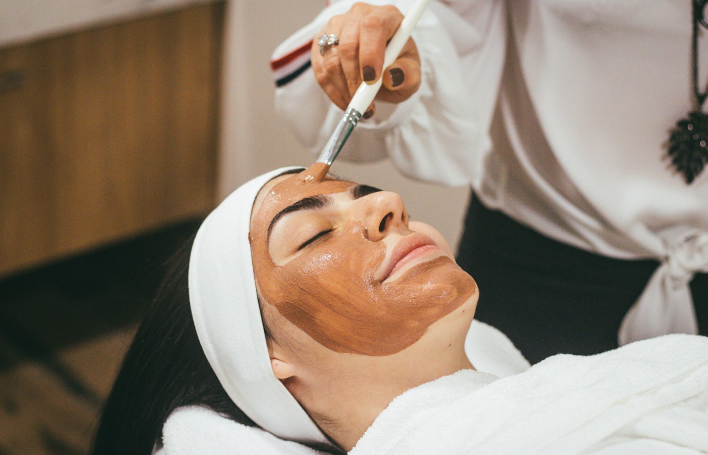 Woman receiving a professional skincare facial treatment